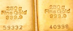 Geldanlage in echtem Gold als Goldbarren und Goldmünzen.