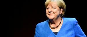 Former German Chancellor Angela Merkel attends a talk about "the challenging issues of our time" with author Alexander Osang at the Berliner Ensemble theatre in Berlin, Germany June 7, 2022. REUTERS/Annegret Hilse