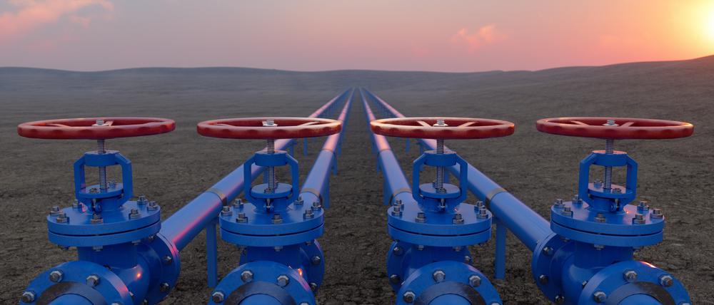 Oil Or Gas Transportation With Blue Gas Or Pipe Line Valves On Soil And Sunrise Background