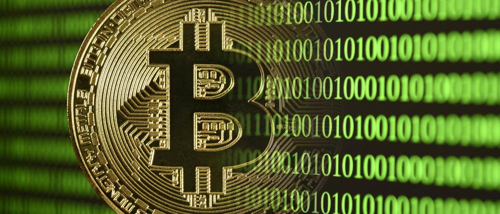 Bitcoin Münze vor Screen