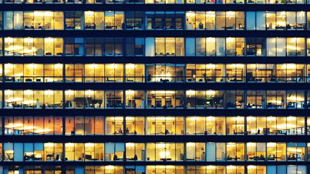 Office workers working late in major office building