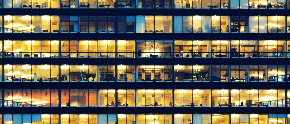 Office workers working late in major office building