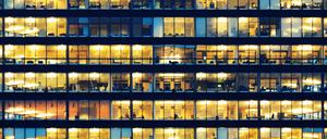 Office workers working late in major office building