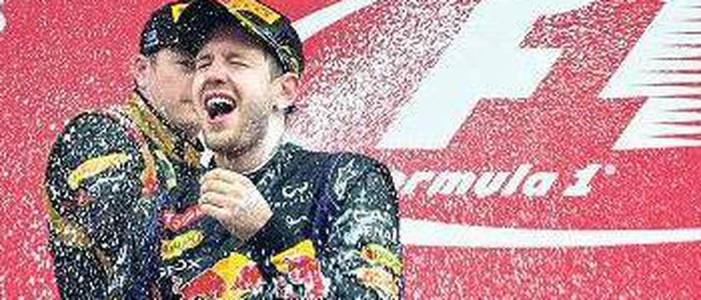 Im Überschwang. Sebastian Vettel kann sich derzeit selbst feiern. Foto: AFP