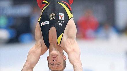 Breit aufgesetzt. Hambüchen überzeugte nicht nur am Reck. Foto: AFP