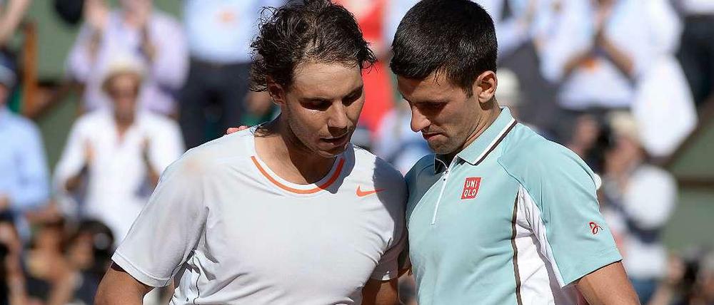 Godzilla und King Kong des Tennis - Arm in Arm.