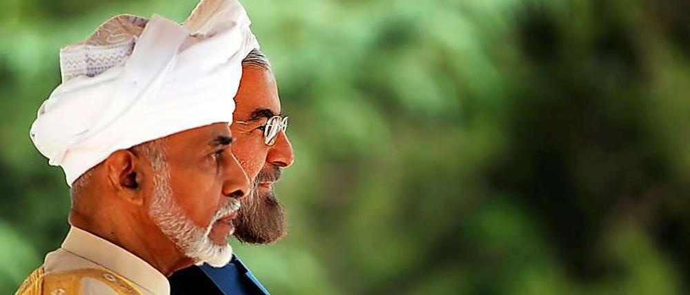 Omans Sultan Qabbous und Irans Präsident Hassan Ruhani. 
