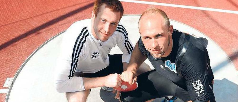 Ring ohne Kampf. Christoph (links) und Robert Harting wollen sich während der Wettkämpfe gegenseitig unterstützen. Foto: dpa