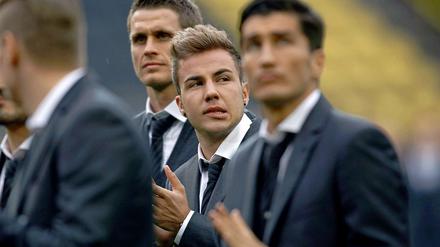 Empfang in der Heimat. Götze (zweiter von rechts) und Sahin (r.). 