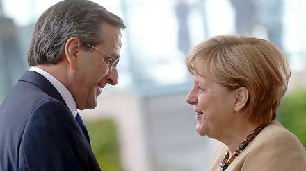 Antonis Samaras, griechischer Premierminister und Bundeskanzlerin Angela Merkel treffen sich am Dienstag um über die Zukunft des krisengeschüttelten Mittelmeerstaates zu beraten.