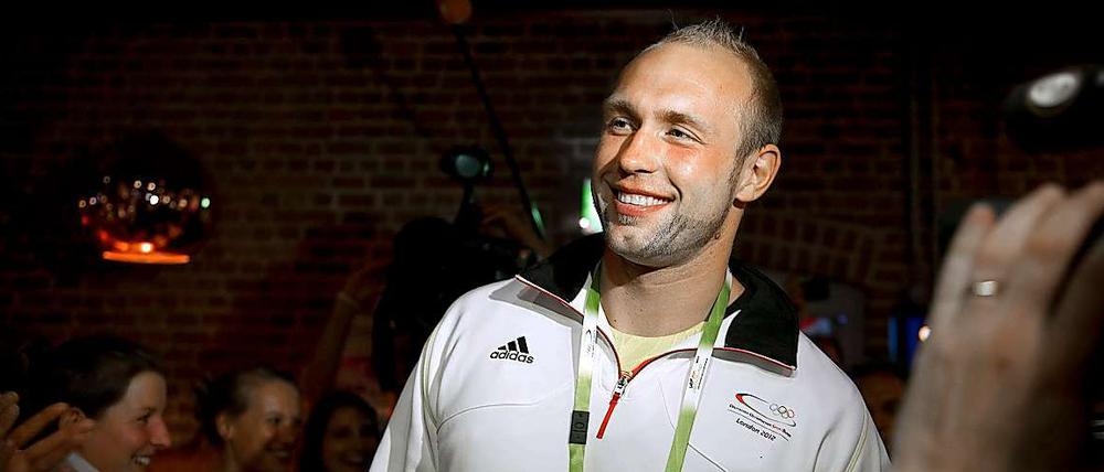 Da feiert er noch fröhlich: Der Berliner Olympiasieger Robert Harting. 