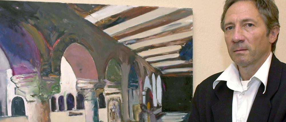 Rudi Kargus im Rathaus seiner Heimatstadt Worms zu Beginn einer Vernissage vor dem Ölgemälde "Andreasstift Ansicht 1". 