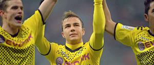 Mario Götze (m.) erzielte den entscheidenden Treffer zum 1:0 für den BVB beim Rekordmeister aus München.