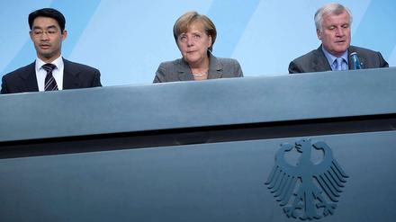 Alle gemeinsam, jeder für sich. FDP-Chef Rösler, Kanzlerin Merkel und CSU-Chef Seehofer (v. l.) verkünden ihre Pläne zur Entlastung der Bürger.