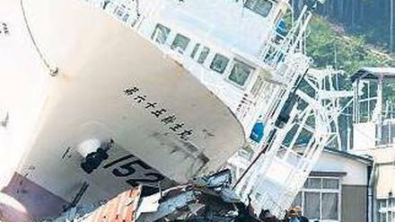 Land unter. Das Beben in Japan hat laut Munich Re einen gesamtwirtschaftlichen Schaden von 210 Milliarden Dollar – deutlich mehr als der Hurrikan Katrina im Jahr 2005. Foto: dpa