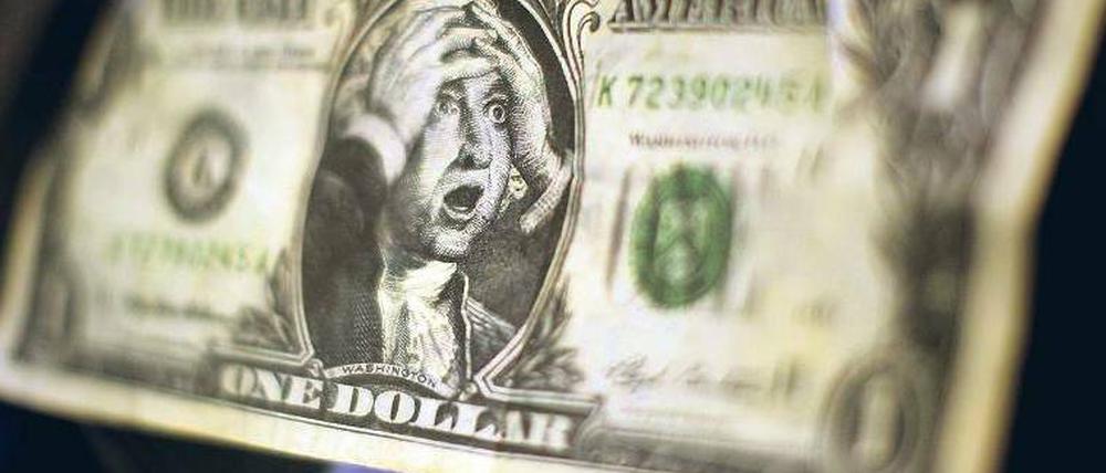 Schock. Einigen sich Demokraten und Republikaner nicht rechtzeitig auf eine Anhebung der Kreditgrenze, steigen die US-Schulden am 2. August über 14,294 Billionen Dollar. Foto: pa/dpa