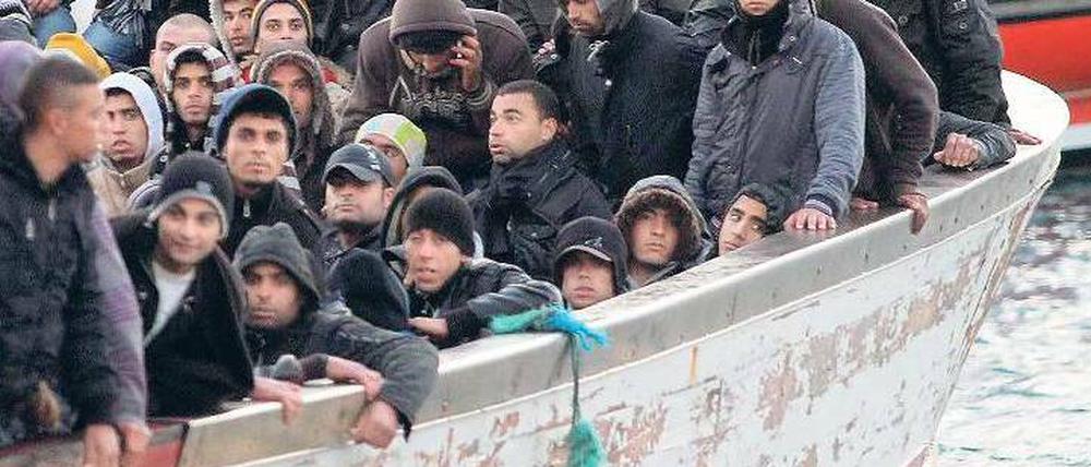 Ankunft auf Lampedusa. Diese Flüchtlinge aus Afrika haben es geschafft. Foto: dpa