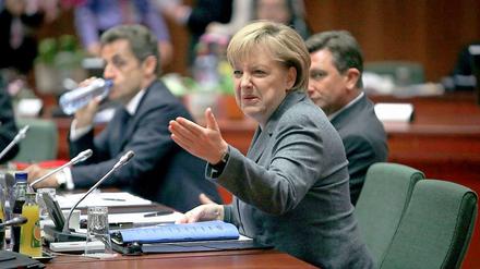 Hart verhandelt. Bundeskanzlerin Angela Merkel fühlte sich nach dem EU-Gipfel am Donnerstag als Siegerin, im Hintergrund Frankreichs Präsident Nicolas Sarkozy.