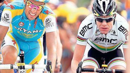 An der Seite der Stars. So sieht sich Cadel Evans (rechts neben dem zweimaligen Tour-Sieger Alberto Contador). Dass er nicht als Spitzenfahrer und Favorit auf den Gesamtsieg wahrgenommen wird, ärgert den Australier gewaltig. Foto: dpa