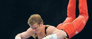 Konzentriert am Reck. Auch Fabian Hambüchen überzeugte in Birmingham. Foto: dpa