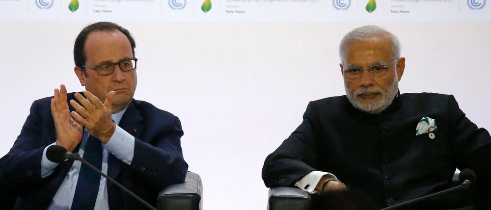 Zum Beginn des Weltklimagipfels haben der französische Präsident Francois Hollande (L) und der Indische Premierminister Narendra Modi eine Initiative zur Verbreitung von Solarenergie vor allem in Tropenländern, die International Solar Alliance (IASTA) vorgestellt.
