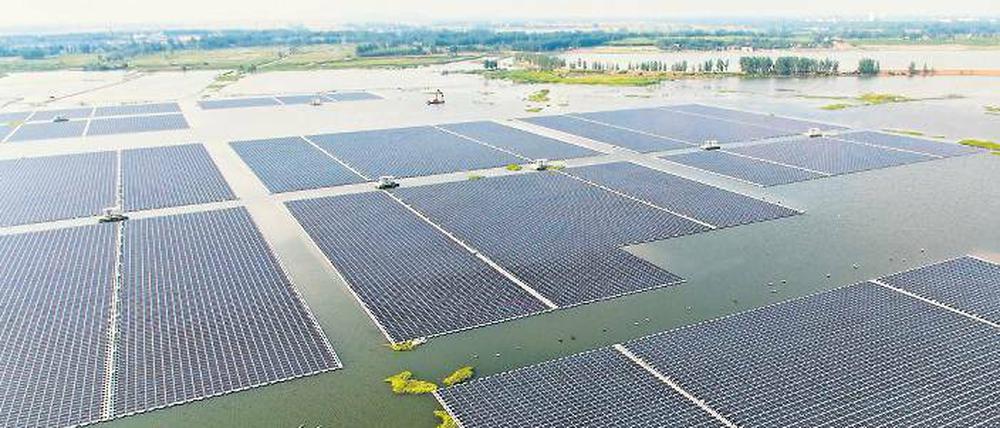 Schwimmende Energie. Das 40-Megawatt-Solarkraftwerk in einem See in Huainan ist das Größte seiner Art und ersetzt ein kollabiertes Kohlekraftwerk.