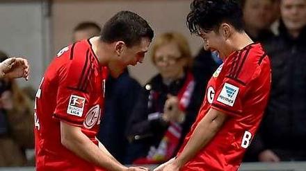 Torschützen unter sich: Kyriakos Papadopoulos (l.) und Heung-Min Son jubeln gemeinsam nach einem Tor.