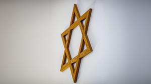 Ein Davidstern hängt an der Wand im Gebetsraum der Neuen Synagoge in Gelsenkirchen.