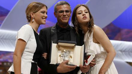 Dreifaches Glück. Léa Seydoux, Abdellatif Kechiche und Adèle Exarchopoulos freuen sich über die Goldene Palme für "La vie d'Adèle".