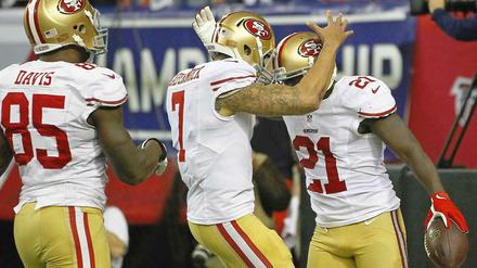 Die San Francisco 49ers um ihren jungen Star-Quarterback Colin Kaepernick (mitte) treffen im Super Bowl auf die Baltimore Ravens.