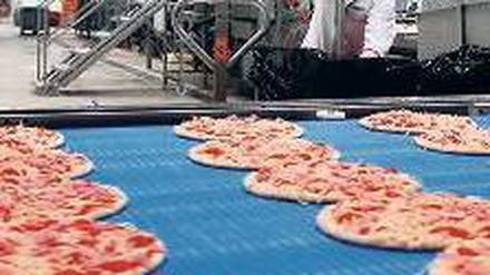 Anders als beim Italiener nebenan: Pizzaproduktion in Berlin. 