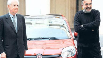 Mit verschränkten Armen stellt sich Marchionne weit weg von Monti. Foto: Reuters