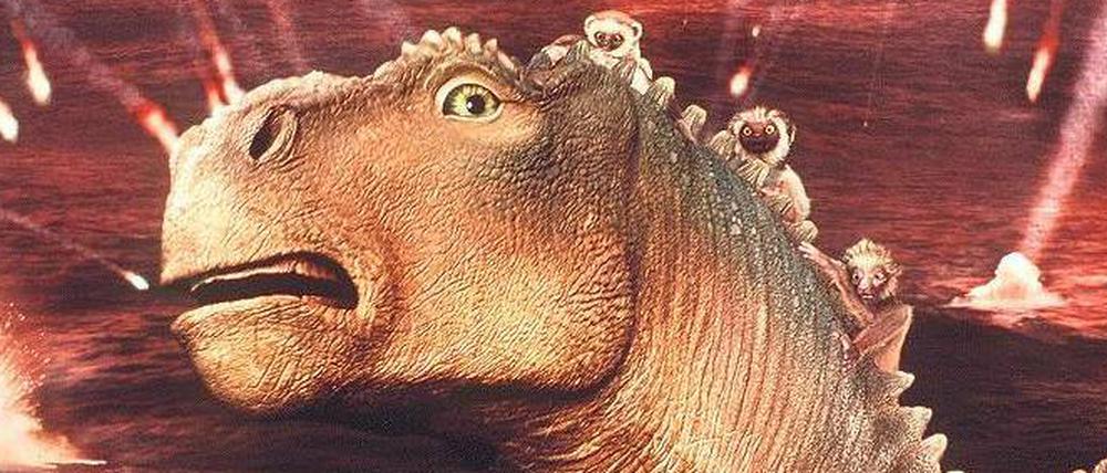 Feurige Aussichten. Betroffen registriert das Iguanodon in dem Disney-Film „Dinosaurier“ Meteoriteneinschläge.