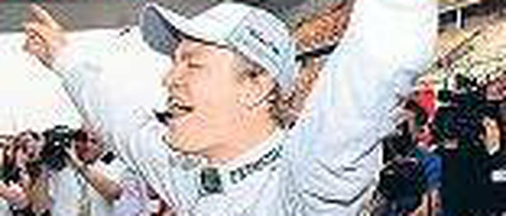 Oben für den Moment. Nico Rosberg gewinnt in Schanghai. Foto: dapd