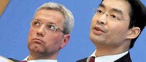 Umweltminister Norbert Röttgen (CDU) und Wirtschaftsminister Philipp Rösler (FDP).