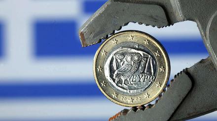 Griechenland in der Klemme: Im März droht die Zahlungsunfähigkeit. Der Verhandlungen um einen Schuldenschnitt mit den privaten Gläubigern kommen indessen nicht voran.