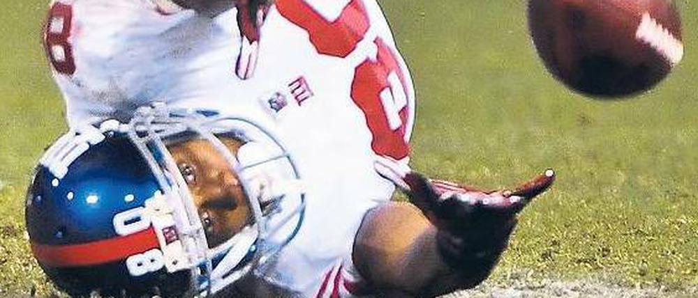 Auf den Kopf gestellt. Victor Cruz und die New York Giants haben überraschend den Super Bowl erreicht.