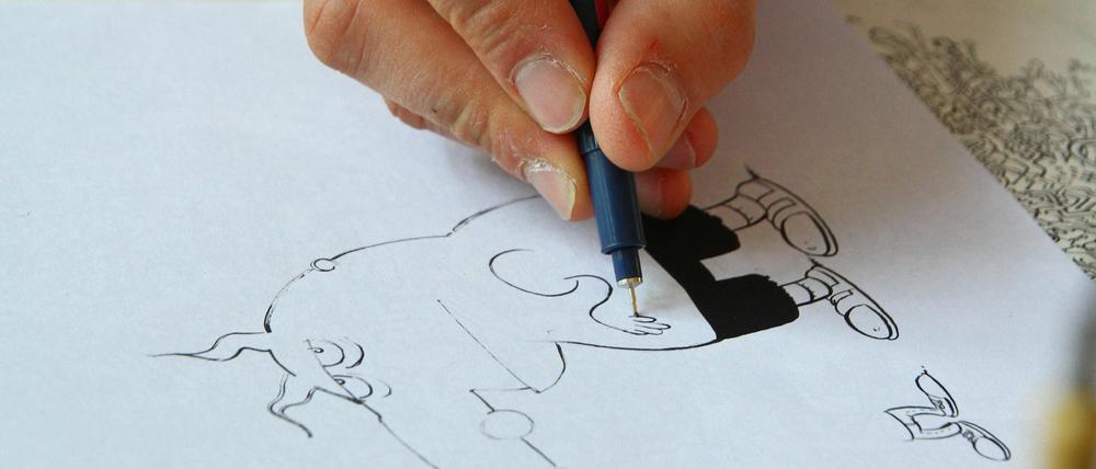 Früh übt sich. Der Berliner Comic-Star Fil - hier bei der Arbeit an einem Didi&amp;Stulle-Comic - zeichnet seit seiner Jugend.