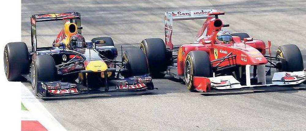 Ganz schön eng. Beim vergangenen Rennen in Monza kamen sich Sebastian Vettel (l.) und Fernando Alonso recht nahe. Foto: dapd
