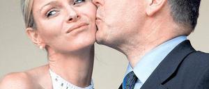 Muss das sein? Der verunglückte Kuss für die Fotografen könnte das Bild dieser Ehe prägen. Foto: AFP