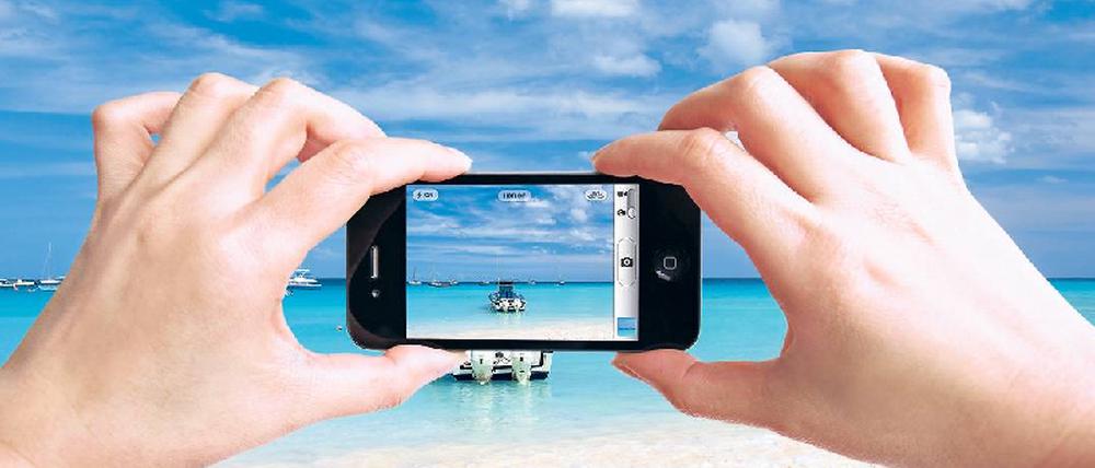 Traumhafte Erinnerung – albtraumhafte Preise. Für das Verschicken von Fotos hat die EU keine Preisgrenze gesetzt. Foto: mauritius images