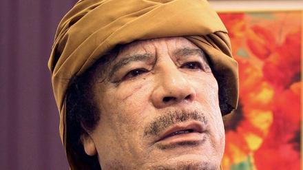 Muammar al Gaddafi.