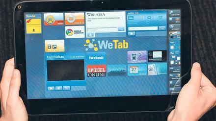 Alternative zum iPad: Der berührungsempfindliche Bildschirm des We-Tab ist mit 11,6 Zoll größer und das Gerät mit 995 Gramm insgesamt schwerer als das iPad von Apple.