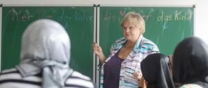 In Sprachkursen lernen Migranten die deutsche Sprache.