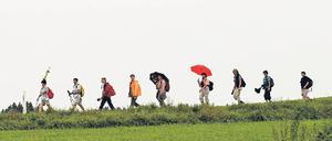 Fröhliche Büßer im Allgäu. Wer nicht allein pilgern will, kann sich an eine „Mitgehzentrale“ wenden.