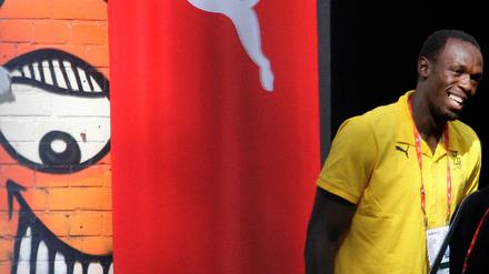 Sprinter Bolt of Jamaica arrives for news conference in Berlin