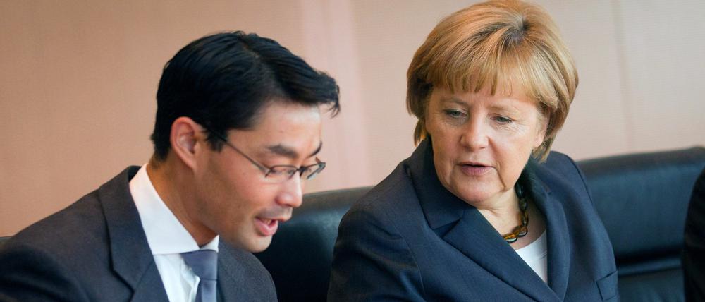 Streit ums Betreuungsgeld: Philipp Rösler (FDP) und Angela Merkel (CDU).