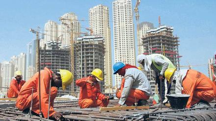Asiatische Bauarbeiter in Dubai.