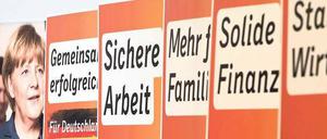 Wände aus Wörtern. Plakatwerbung für Angela Merkel. 