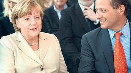 Stolz wie Eric. IHK-Chef Schweitzer freut sich über den Besuch der Kanzlerin. 